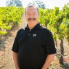 Rick Quinn, in a section of one of his vineyards, pauses for a photo.