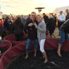 Enjoying themselves immensely while stomping grapes and imbibing of the finished product, Columbus Serbs, Dave and Sharon Tumbas, pause for a photo.